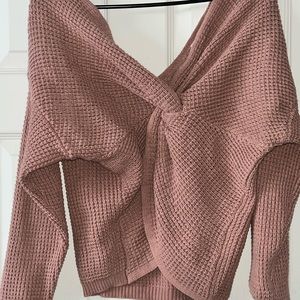 This is a sweater for a nice fall day. It has a cross design in the front!